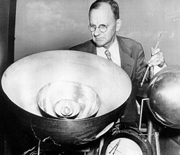 Photo of Heck working with a meteorological instrument.