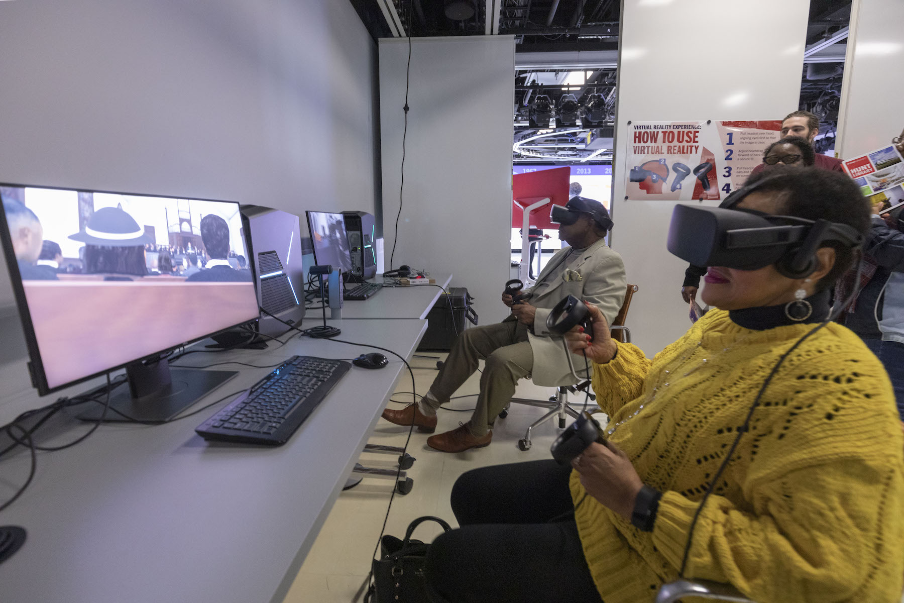 A person in a yellow sweater wearing a VR headset