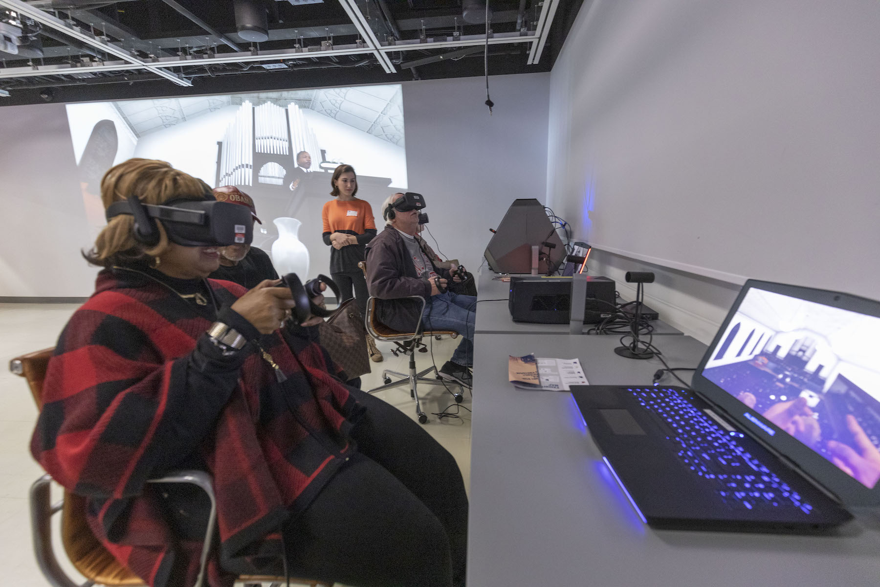 A person in a red coat wearing a VR headset