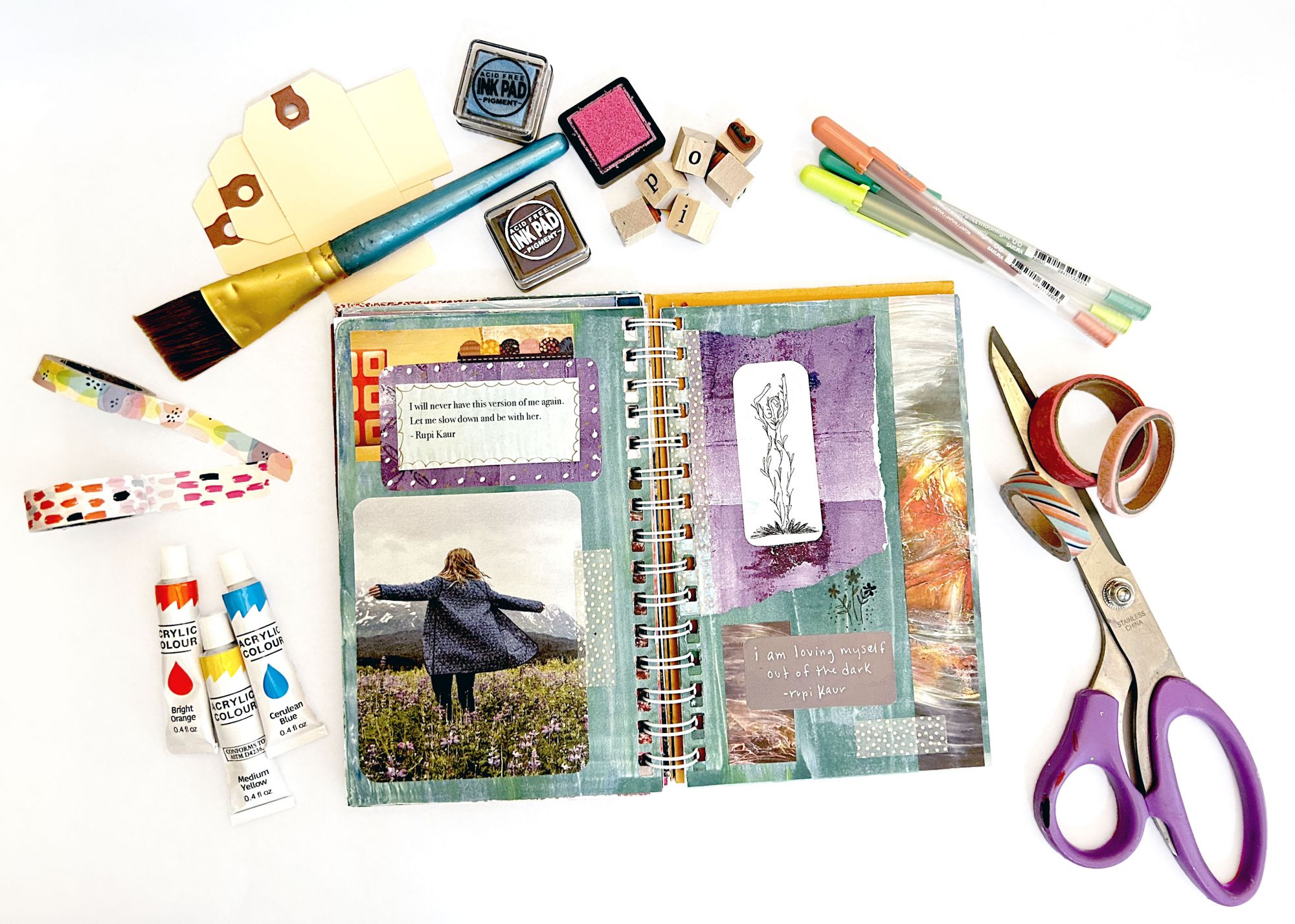 An image of a notebook, scissors and other craft supplies