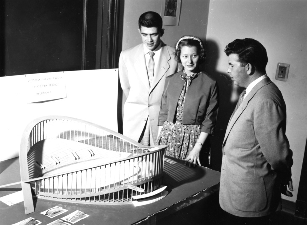 Group looking at model for Engineers Fair venue, Dorton Arena, 1950
