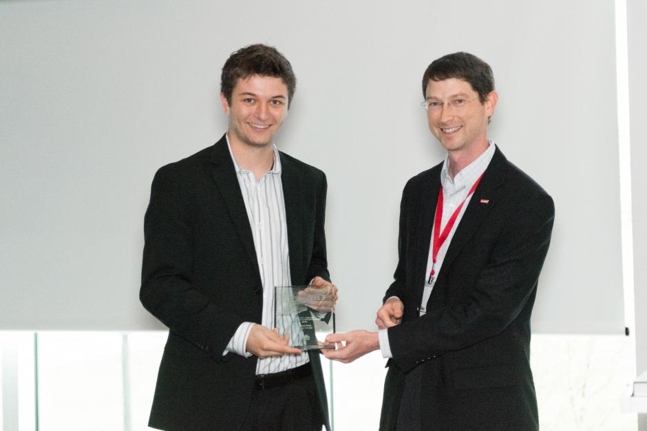 Director of Visualization Services Mike Nutt presents Anthony Smith with his award at the Code+Art awards ceremony.

