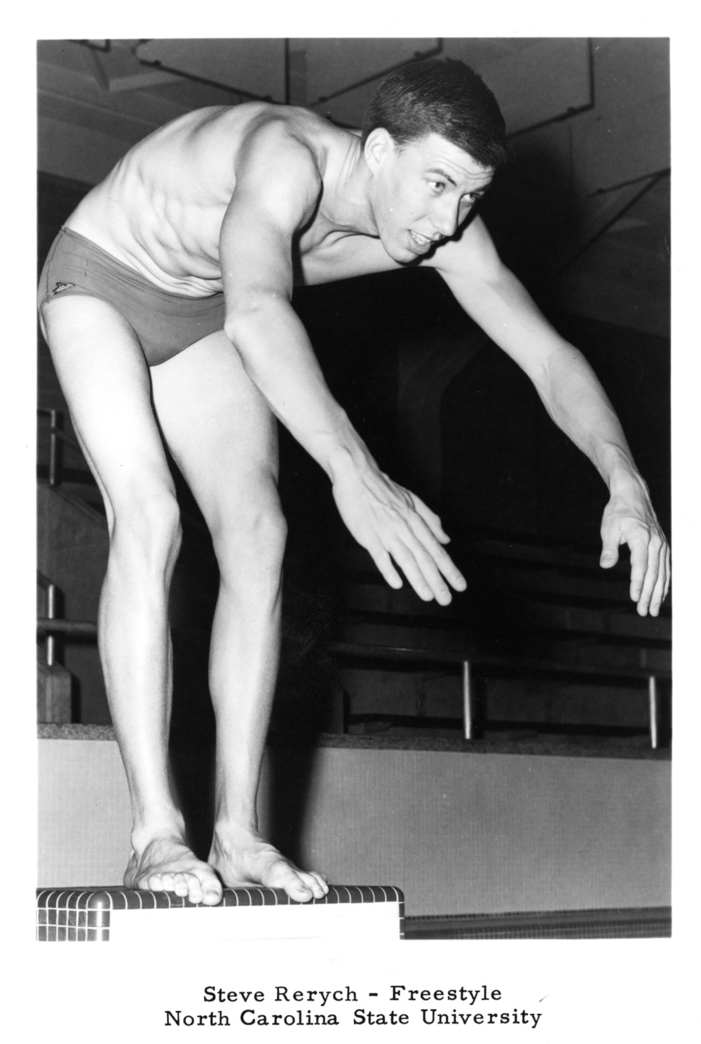 Black and white photo of NC State swimmer Steve Rerych as he is about to dive into the pool.