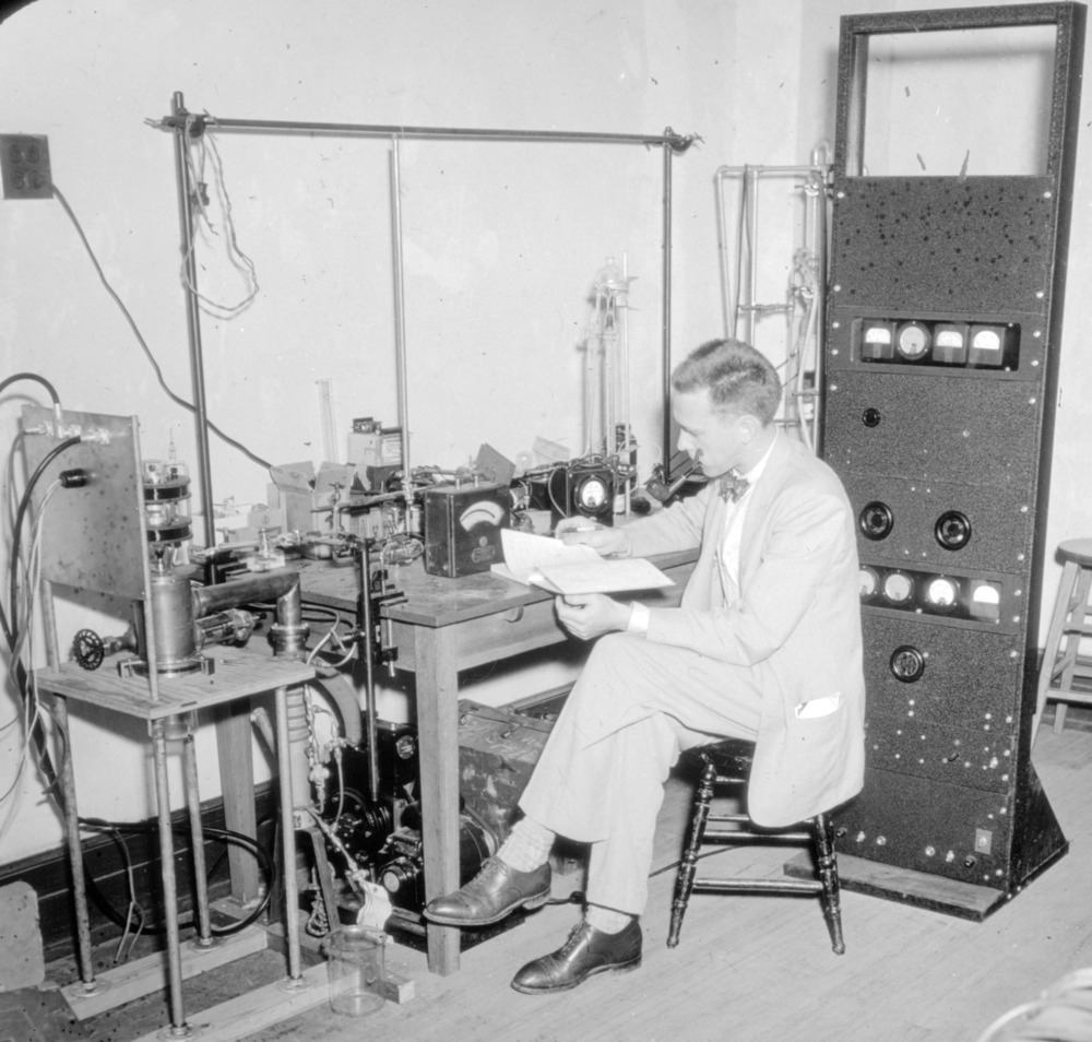 Man experimenting with radio frequency ion source in Unnamed Building (formerly Daniels Hall).
