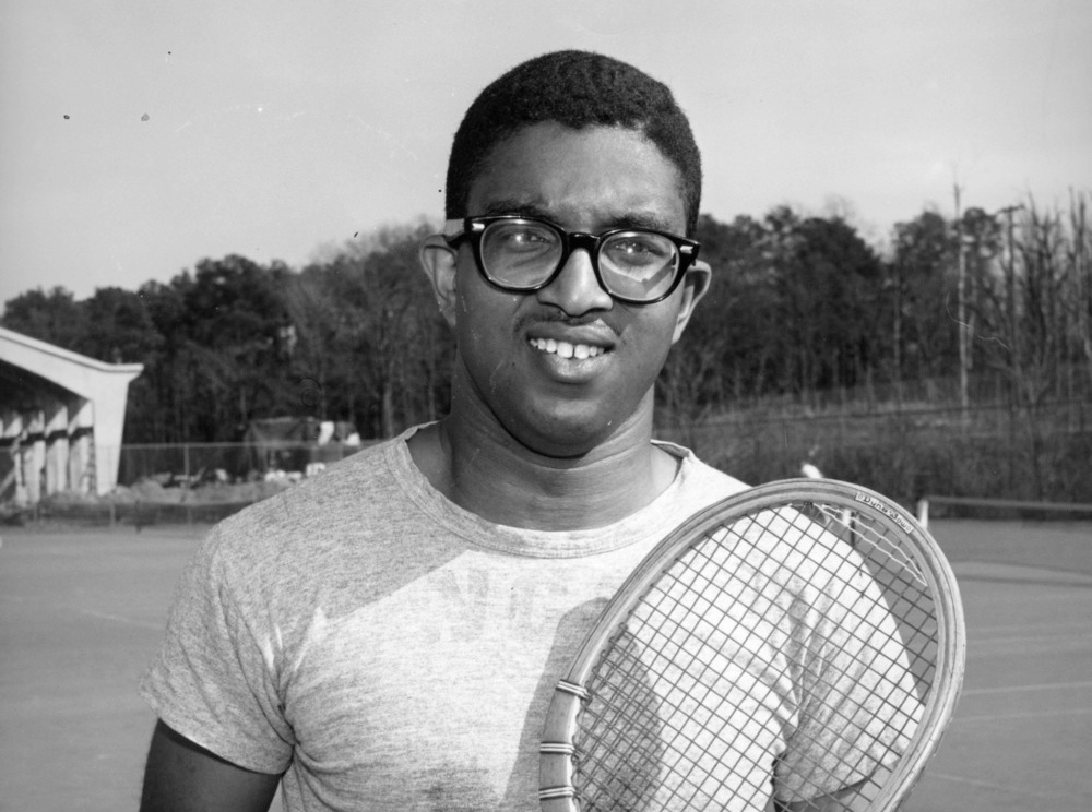 Irwin Holmes on tennis court, 1957
