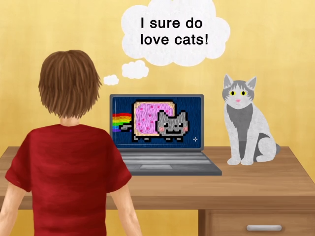 Student and rainbow cat in front of the computer