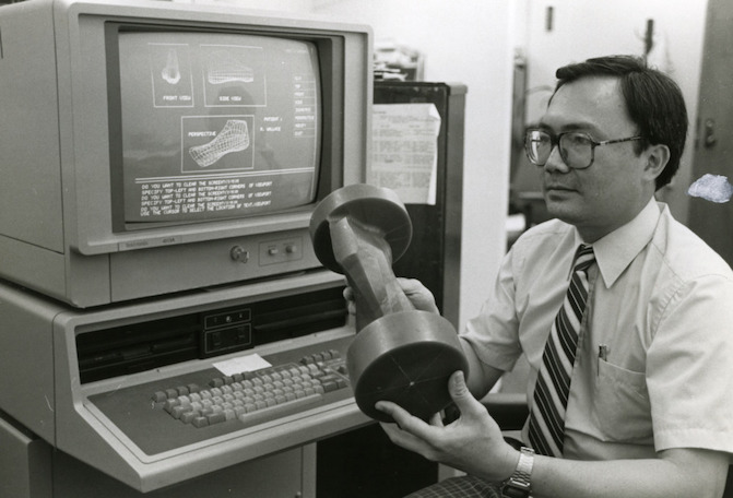 Dr. Han P. Bao with shoe last designed with computer-aided techniques