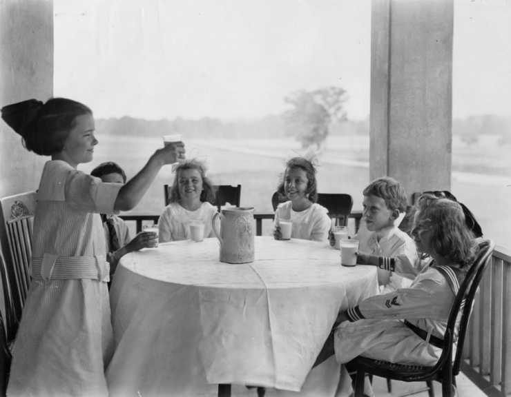 Six children drinking milk, ca. 1920.