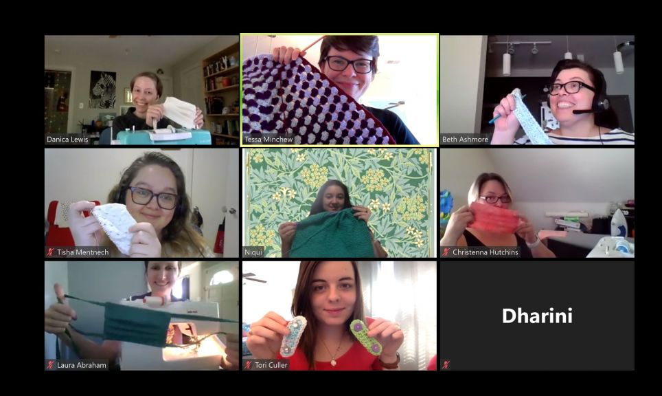 Staff members sew together on a recent Zoom call.