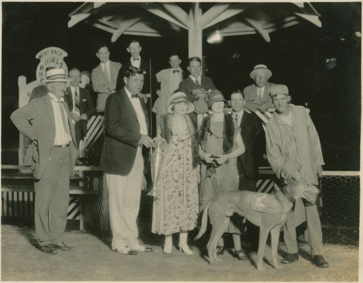 Baseball legend Babe Ruth poses with other spectators with a winning greyhound Racing Ramp at the Derby Lane Greyhound Track in St. Petersburg, Florida, in 1925.