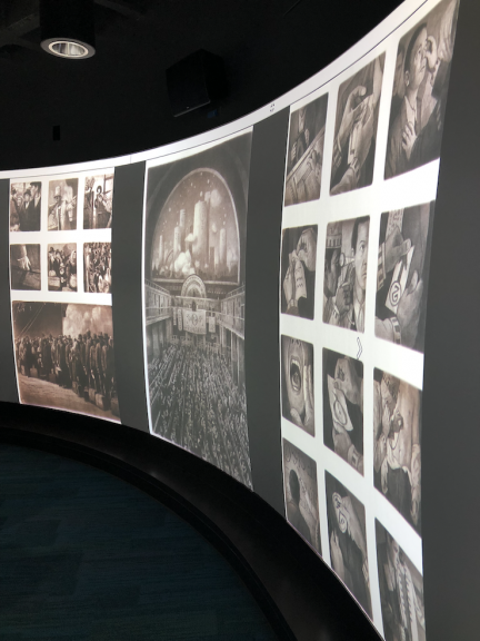 Digitized images from the graphic novel, The Arrival by Shaun Tan is displayed on specialized screens in the Visualization Studio.
