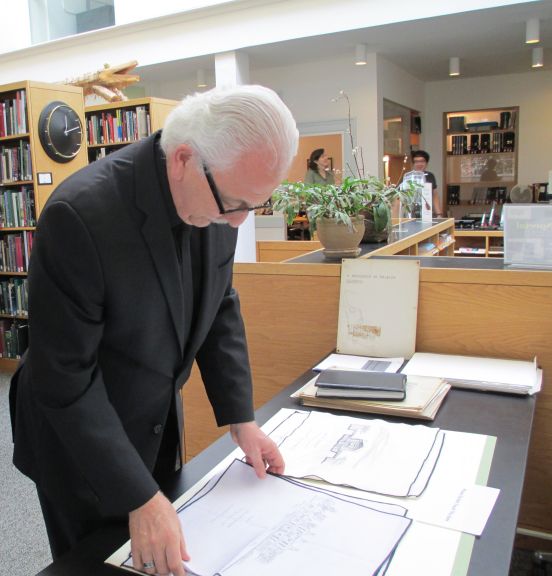 Marvin Malecha at the College of Design Library reviewing his donated materials during a Special Collections event, 2013