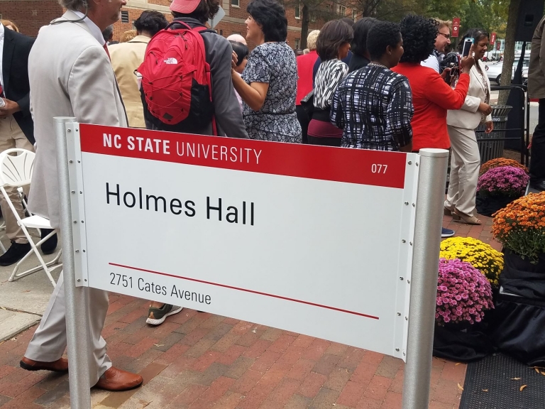 New sign for Holmes Hall unveiled at dedication ceremony, November 1, 2018.