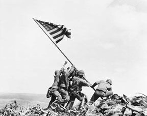 U.S. Marines raise the American flag at Iwo Jima, February 23, 1945. Photo by Joe Rosenthal.