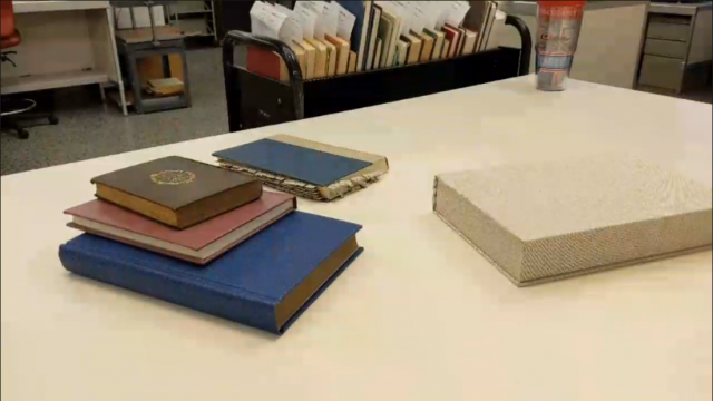 The conservation lab, showing a table with a few stacks of books on it.