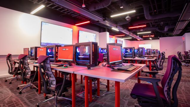 Interior of NC State Esports Lab with gaming computers and chairs