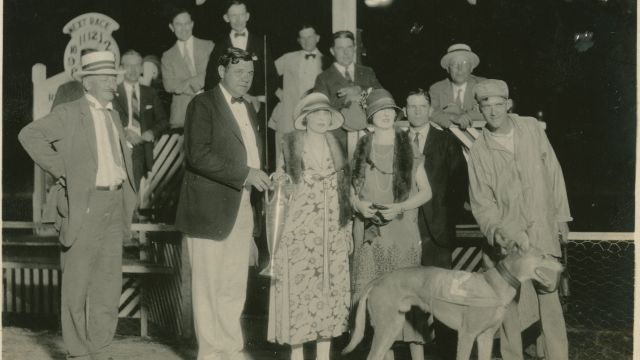 Baseball legend Babe Ruth poses with other spectators with a winning greyhound Racing Ramp at the Derby Lane Greyhound Track in St. Petersburg, Florida, in 1925.
