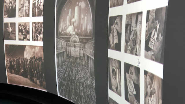 Digitized images from the graphic novel, The Arrival by Shaun Tan is displayed on specialized screens in the Visualization Studio.