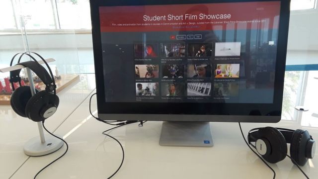 Computer monitor displaying a grid of videos