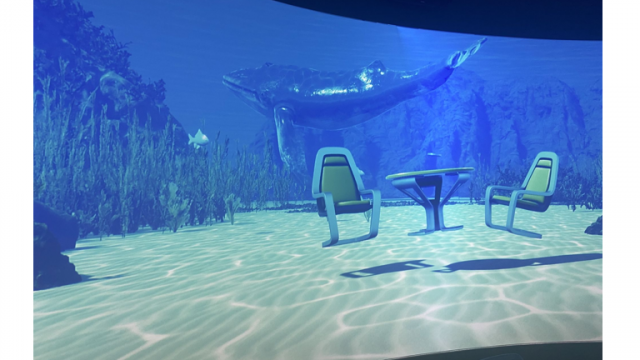 An image of the ocean floor with simulated table and chairs