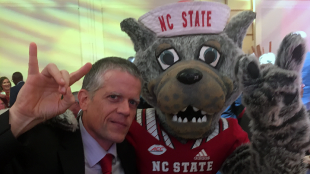 Senior Vice Provost and Director of Libraries Greg Raschke and NC State University Mascot Mr. Wuf