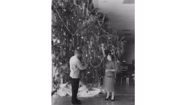 Decorating the Christmas tree at the College Union, 1955