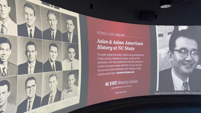Wide screen showing yearbook photos of eight white men and one Asian man