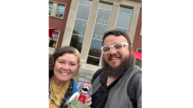 Libraries staff Justin and Katelan Haynes with their 2023 Day of Giving “Where's Mr. Wuf? Scavenger Hunt” social media challenge prize