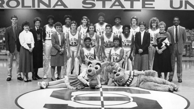 Ms. Wuf and Mr. Wuf with the 1986-1987 NC State University women's basketball team