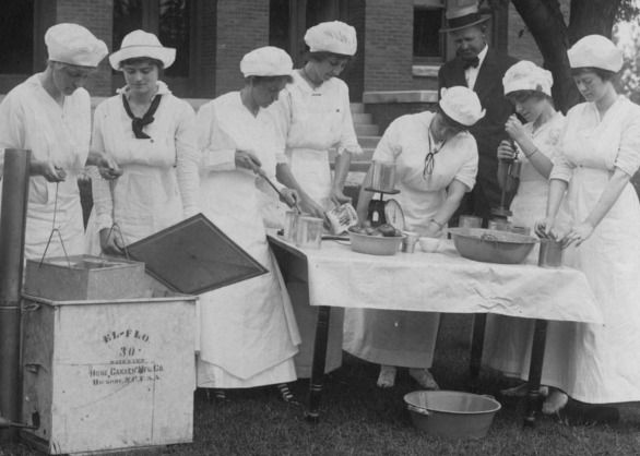 Home demonstration agents learning to can vegetables.  They put their food preparation and preservation skills to good use in organizing dozens of soup kitchens during the 1918 pandemic. 