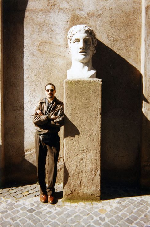 Phil Freelon posing next to a sculpture at an Italian quarry.