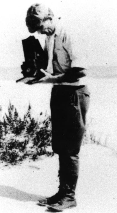 Wells with his camera, probably during the 1920s.