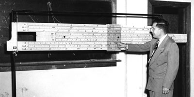 1950: Mathematics Professor John W. Cell and a giant slide rule.  Cell served on the NC State faculty for 32 years.  He served as department head from 1957 until his death in 1967.