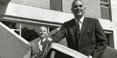 1964: Arthur Clayton "Buck" Menius (right), the first dean of the School of Physical Sciences and Applied Mathematics, and Associate Dean Raymond Stainback moving in to Cox Hall.