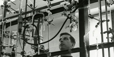 1970: Student working in a chemistry lab.